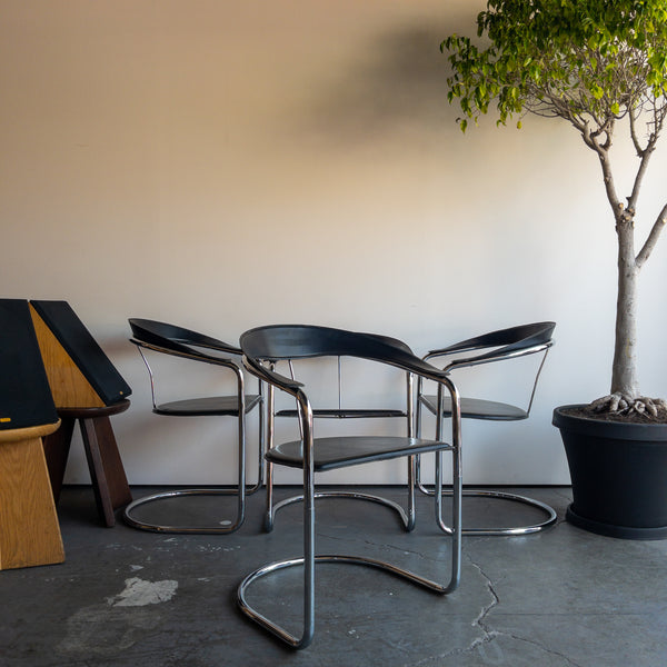 Black and Chrome Curved Leather Dining Chairs