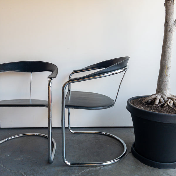 Black and Chrome Curved Leather Dining Chairs